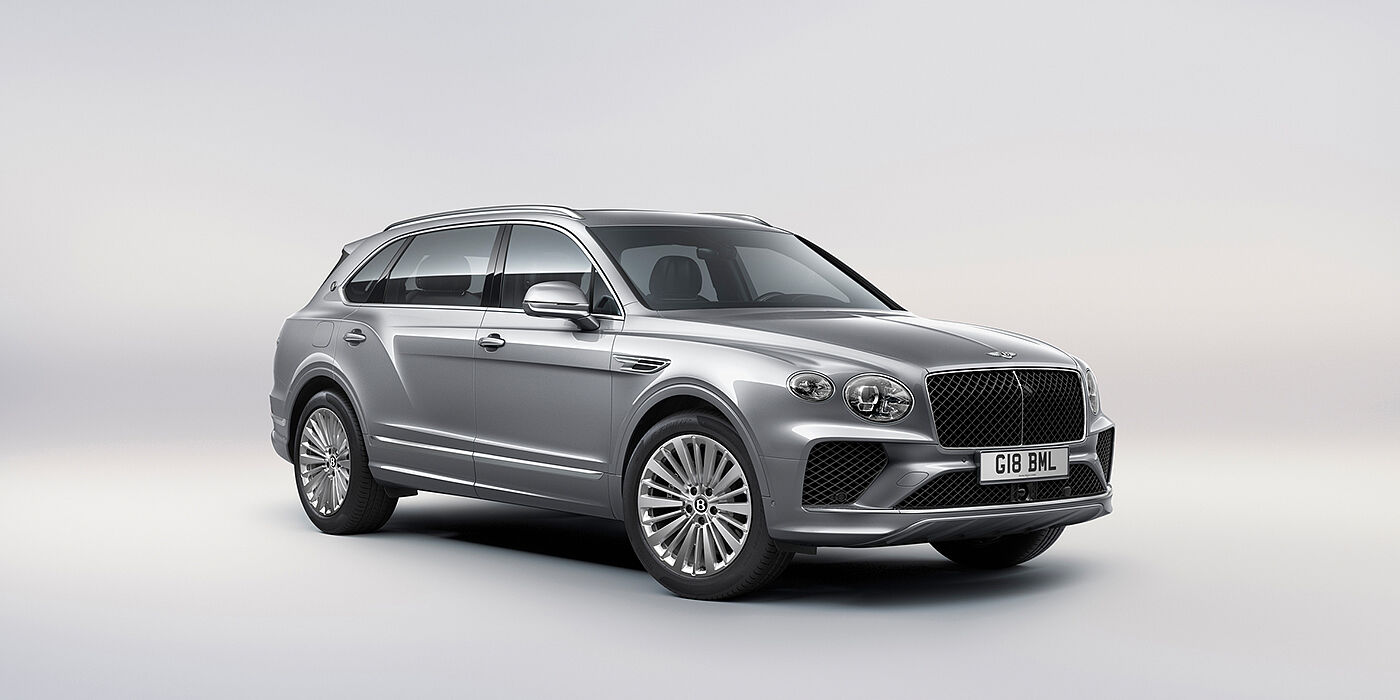 Bentley Rotterdam Bentley Bentayga Extended Wheelbase luxury SUV front three quarter view in Moonbeam paint with 21 inch five spoke painted wheels