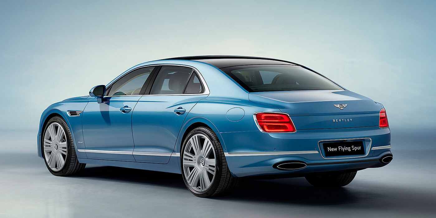 Bentley Rotterdam New Bentley Flying Spur Azure sedan rear view in Light windsor blue by Mulliner paint with 22 inch Azure wheels and chrome exterior details