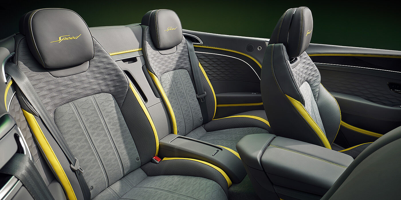 Bentley Rotterdam Bentley New Continental GTC Speed convertible rear interior with unique Speed colour split in Gravity Grey and Cyber Yellow hide colours, and contrast stitched headrest emblems 