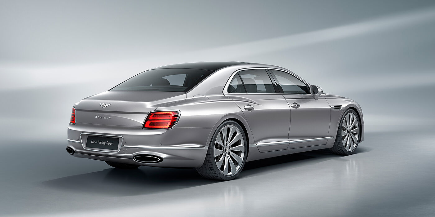 Bentley Rotterdam New Bentley Flying Spur sedan rear view in Silverlake paint with ten spoke wheels and chrome matrix grille